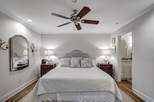 bedroom with ornamental molding, hardwood / wood-style floors, ceiling fan, and ensuite bath