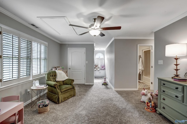 sitting room with crown molding, light colored carpet, and ceiling fan