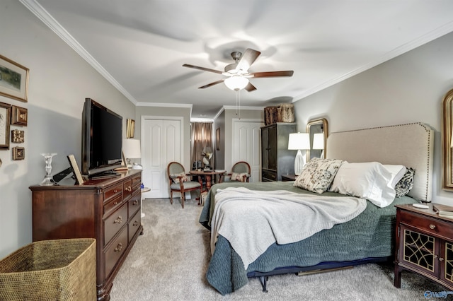 bedroom featuring ornamental molding, light colored carpet, and ceiling fan