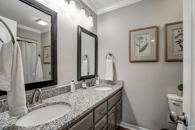 bathroom featuring ornamental molding, vanity, and toilet