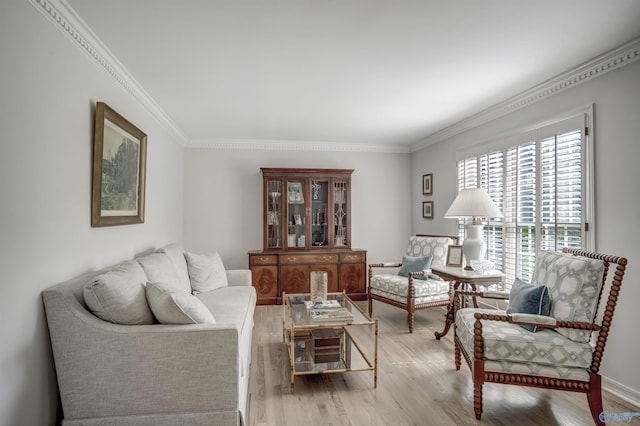 living room featuring crown molding and light hardwood / wood-style flooring