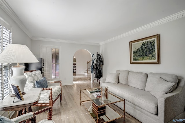 living room with light hardwood / wood-style flooring and ornamental molding