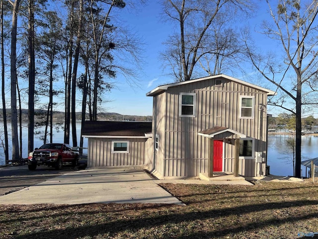 view of outbuilding featuring a water view