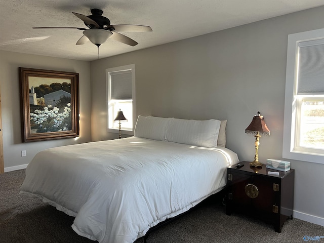 bedroom featuring ceiling fan, carpet flooring, and baseboards