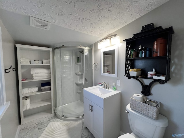 full bathroom with marble finish floor, visible vents, a stall shower, a textured ceiling, and vanity