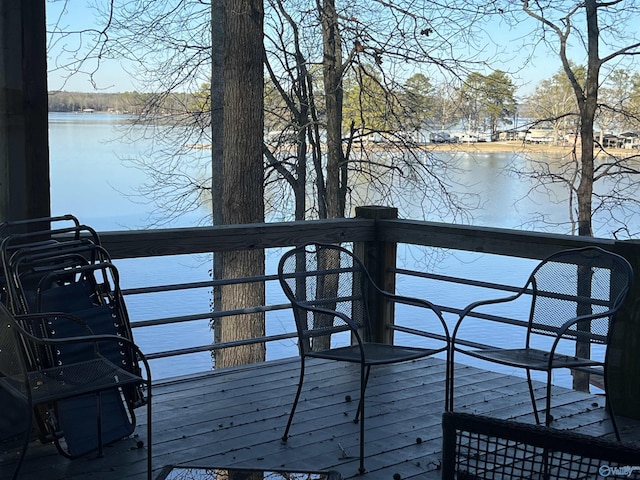 wooden deck featuring a water view