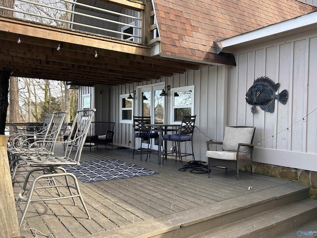 wooden terrace featuring outdoor dining space