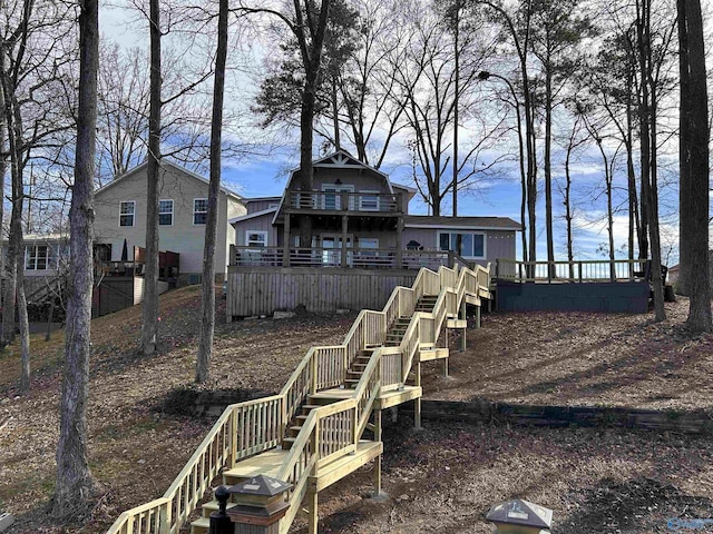 view of yard featuring stairs and a wooden deck