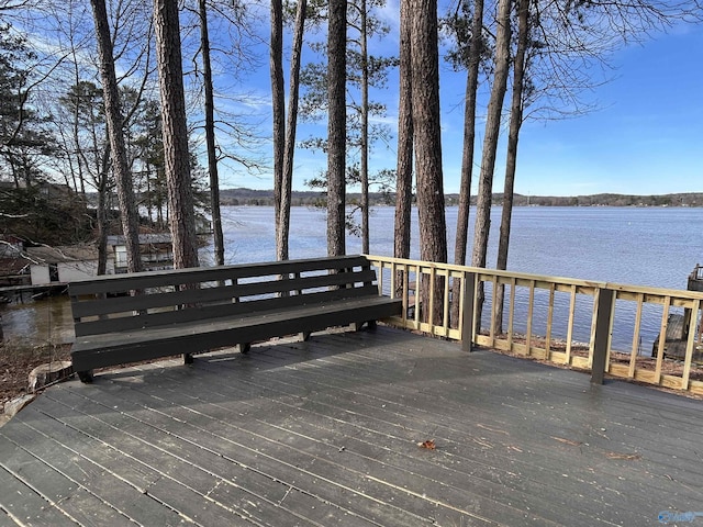 view of dock featuring a deck with water view