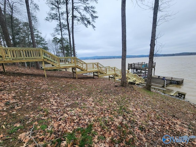 dock area with a water view and stairs