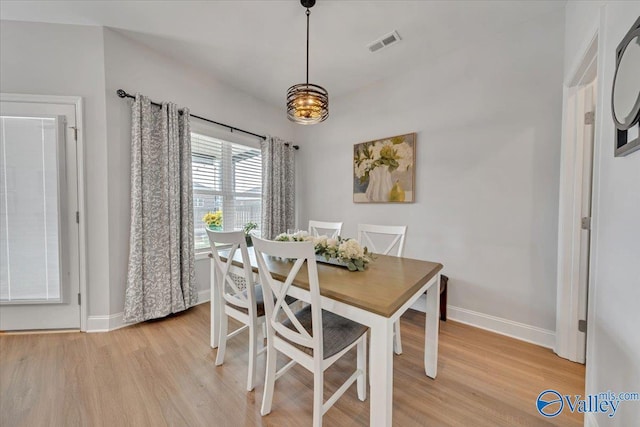 16604 Demi Dr, Athens, AL 35613 - dining room featuring light wood-type flooring, visible vents, and baseboards