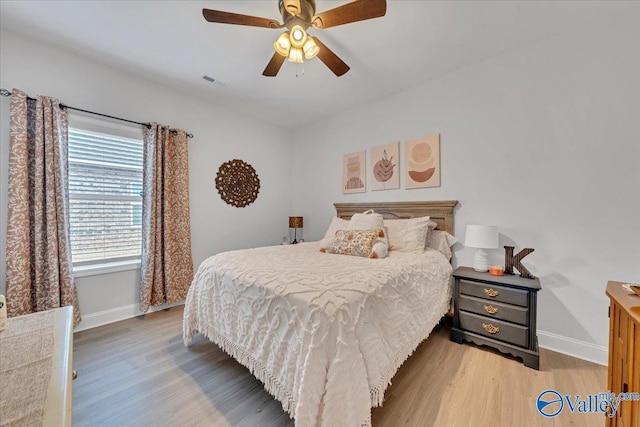 16604 Demi Dr, Athens, AL 35613 - bedroom with a ceiling fan, light wood-type flooring, visible vents, and baseboards