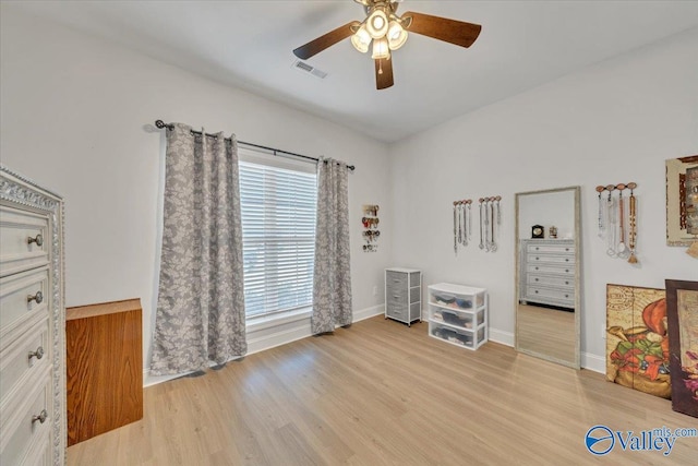 16604 Demi Dr, Athens, AL 35613 - interior space featuring a ceiling fan, baseboards, visible vents, and light wood finished floors