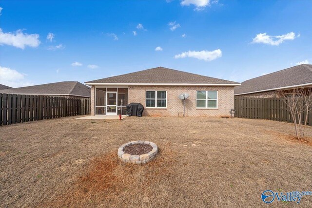 16604 Demi Dr, Athens, AL 35613 - rear view of property with a sunroom, a fenced backyard, a lawn, and brick siding