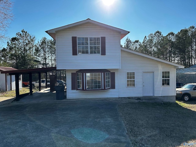 view of front of home featuring a carport