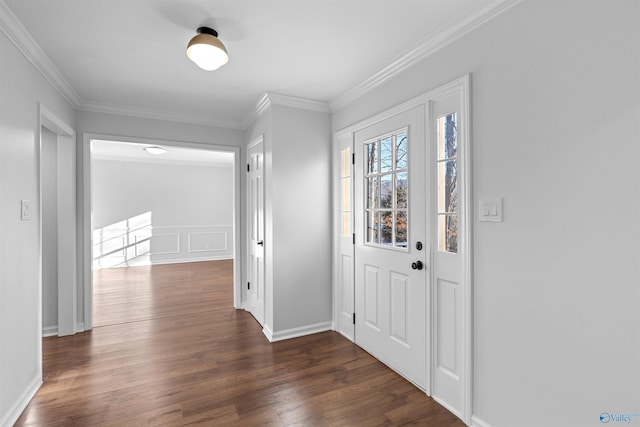 entrance foyer with ornamental molding and dark wood-type flooring