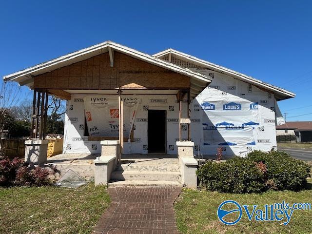 unfinished property featuring a porch