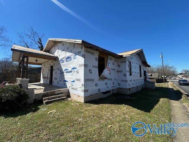 view of property exterior with a yard