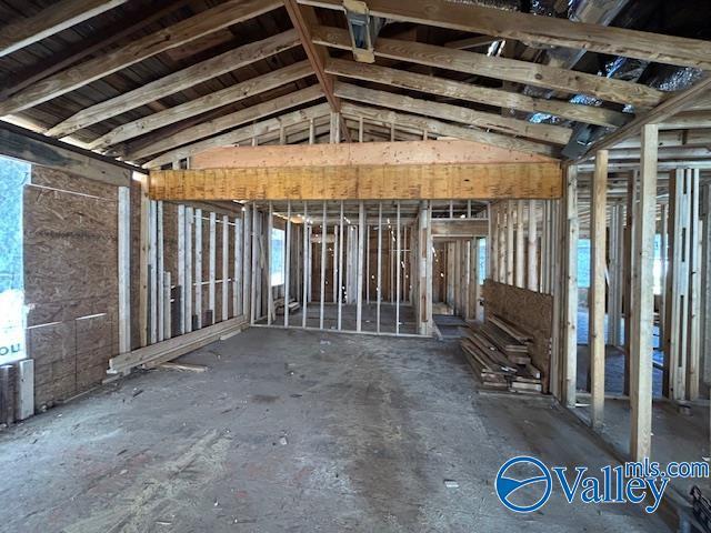 miscellaneous room with lofted ceiling