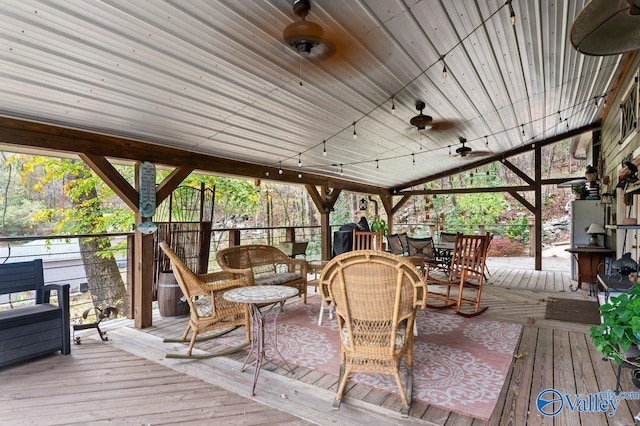 wooden deck with ceiling fan