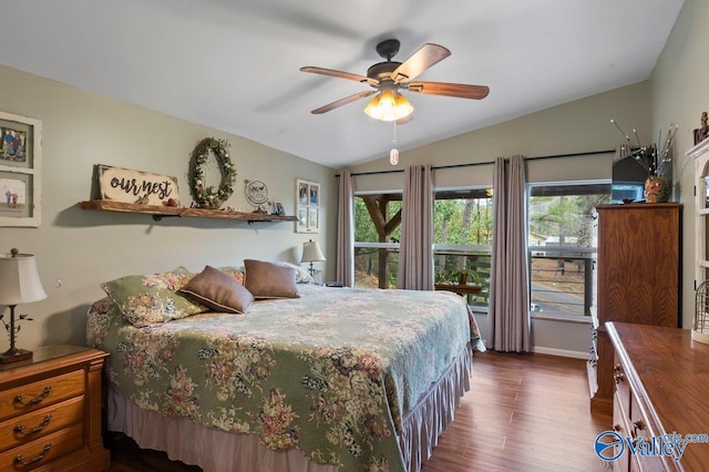 bedroom with dark wood-type flooring, ceiling fan, and lofted ceiling