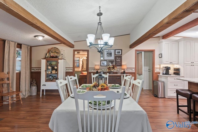 dining space featuring a textured ceiling, lofted ceiling with beams, dark hardwood / wood-style floors, and an inviting chandelier