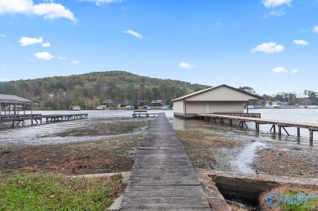 dock area featuring a water and mountain view