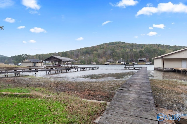 view of dock featuring a water and mountain view