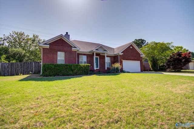 ranch-style home featuring a garage and a front yard