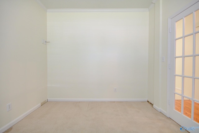 carpeted empty room featuring ornamental molding