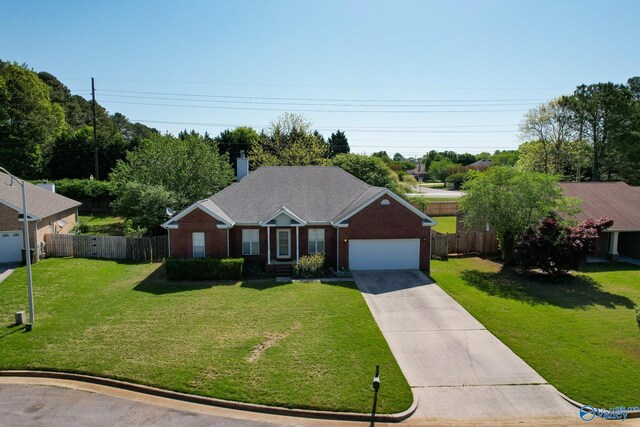 ranch-style house with a garage and a front lawn