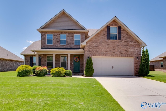 view of front of property featuring a garage and a front yard