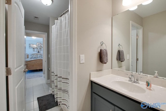 bathroom featuring vanity and tile patterned flooring