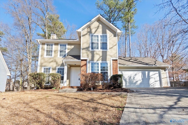 traditional-style home with aphalt driveway, a garage, brick siding, fence, and a chimney