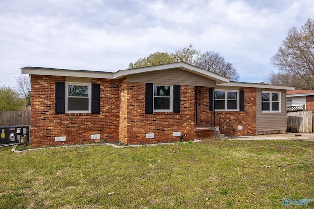 ranch-style home with brick siding, crawl space, a front lawn, and fence