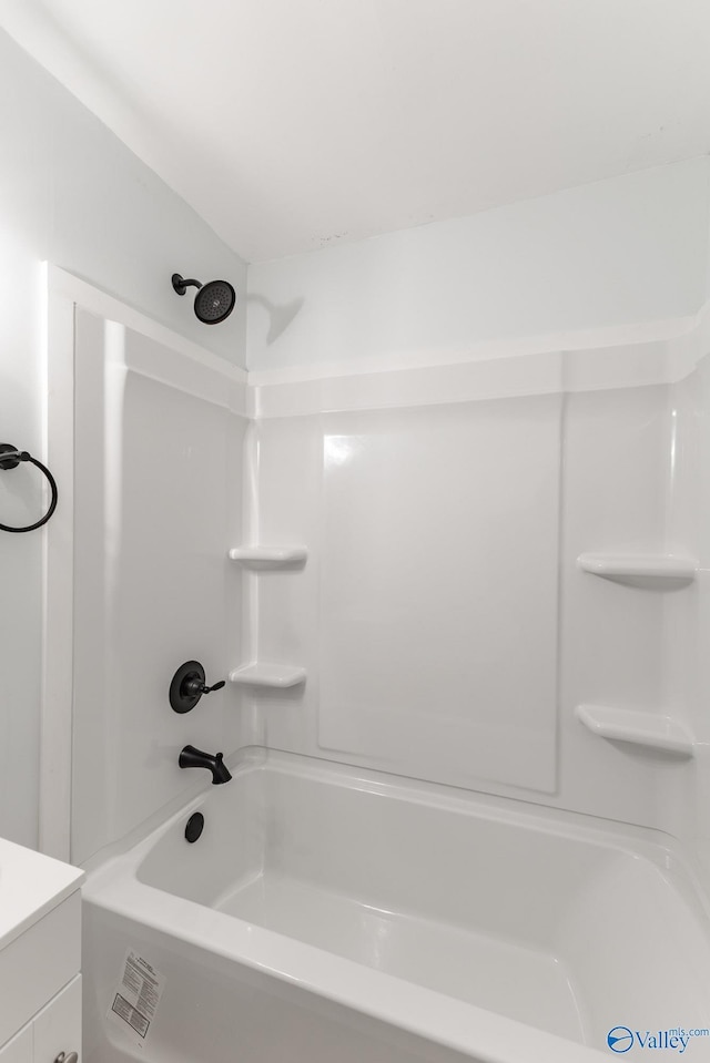full bath featuring vanity and shower / washtub combination