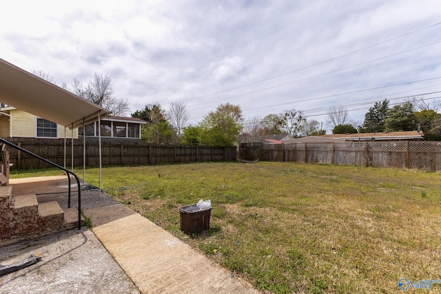 view of yard with a fenced backyard