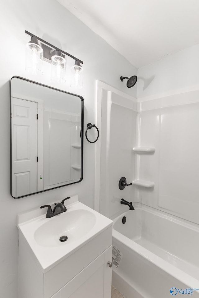 bathroom with shower / bathing tub combination and vanity