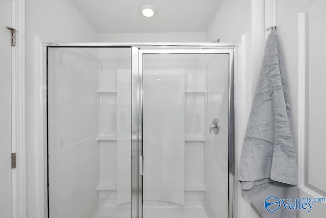full bath featuring a shower stall