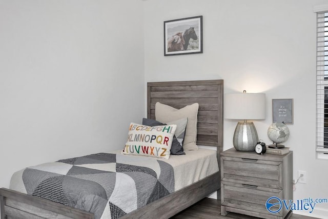 bedroom featuring wood finished floors