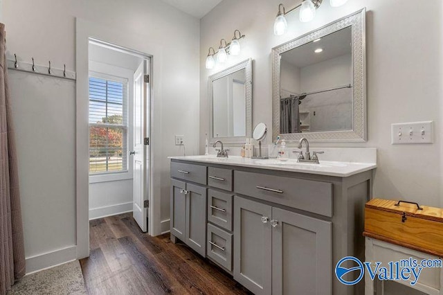 bathroom with vanity, hardwood / wood-style flooring, and a shower with curtain