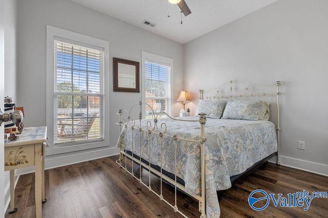 bedroom with ceiling fan and dark hardwood / wood-style floors