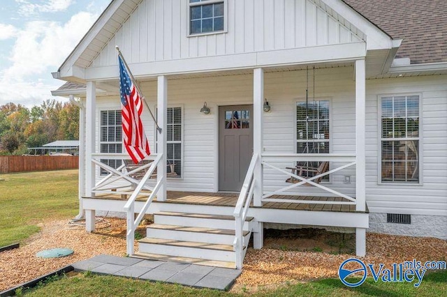 doorway to property featuring covered porch