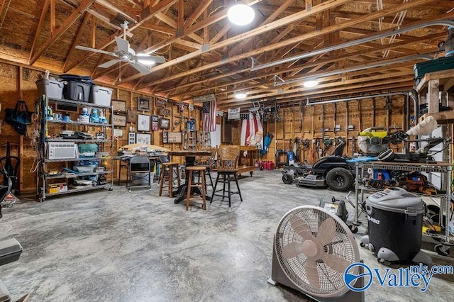 garage with a workshop area and ceiling fan