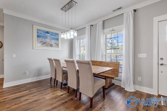 dining space with dark wood-type flooring