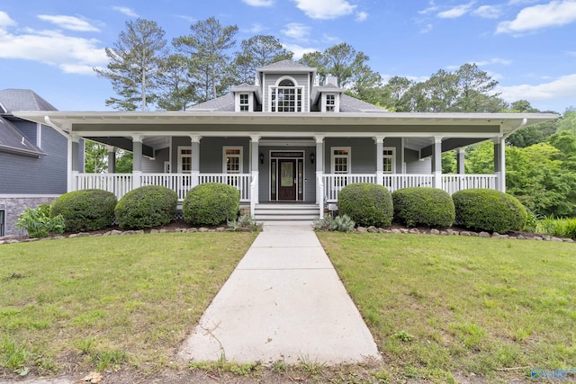 119 Railway Ln SE, Huntsville, AL 35803 - farmhouse featuring a front lawn, covered porch, and roof with shingles