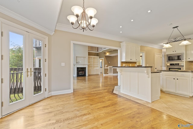 119 Railway Ln SE, Huntsville, AL 35803 - kitchen with stainless steel appliances, ornamental molding, dark countertops, decorative backsplash, and french doors