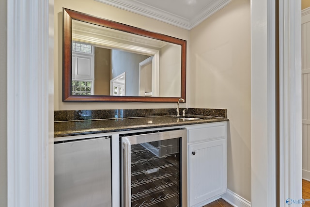 119 Railway Ln SE, Huntsville, AL 35803 - indoor wet bar featuring wine cooler, crown molding, and fridge