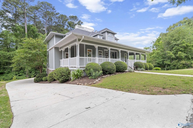 119 Railway Ln SE, Huntsville, AL 35803 - farmhouse-style home with a porch, a front yard, and concrete driveway
