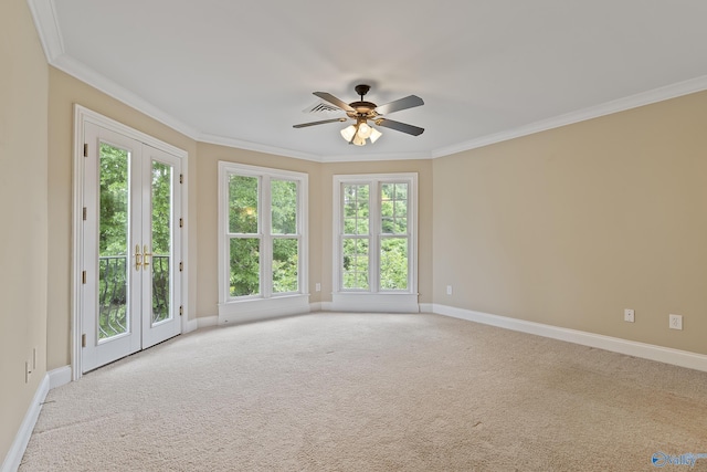 119 Railway Ln SE, Huntsville, AL 35803 - carpeted spare room with ornamental molding, plenty of natural light, baseboards, ceiling fan, and french doors